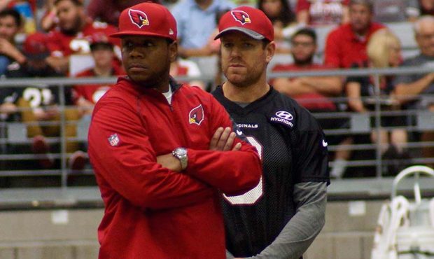 QB Carson Palmer and coaching intern Byron Leftwich during training camp Aug. 8. (Photo by Adam Gre...