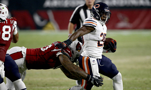 Chicago Bears running back Ka'Deem Carey (25) is tackled by Arizona Cardinals defensive tackle Robert Nkemdiche during the first half of a preseason NFL football game, Saturday, Aug. 19, 2017, in Glendale, Ariz. (AP Photo/Ross D. Franklin)