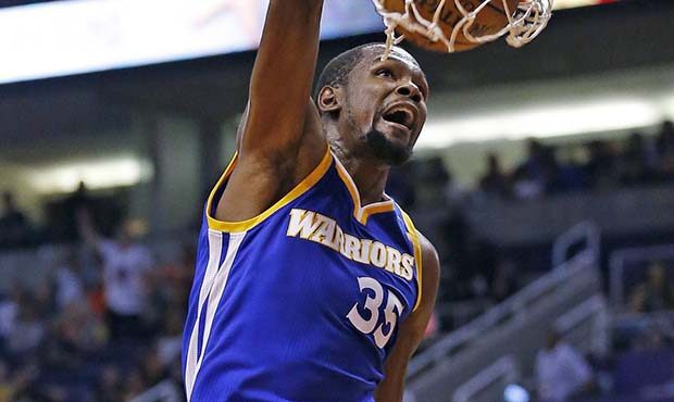 Golden State Warriors forward Kevin Durant dunks against the Phoenix Suns during the first half of ...