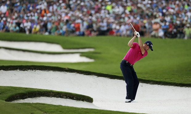 Justin Thomas hits from the bunker on the 18th hole during the final round of the PGA Championship ...