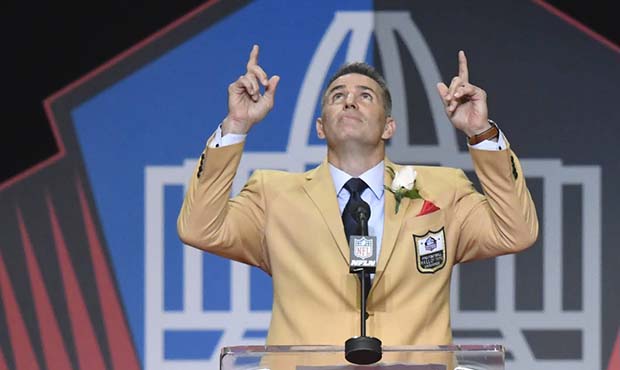 Former NFL quarterback Kurt Warner points to the sky at the end of his speech during inductions at ...