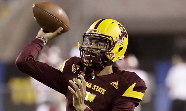 Arizona State quarterback Manny Wilkins (5) warms up for the team's NCAA college football game agai...