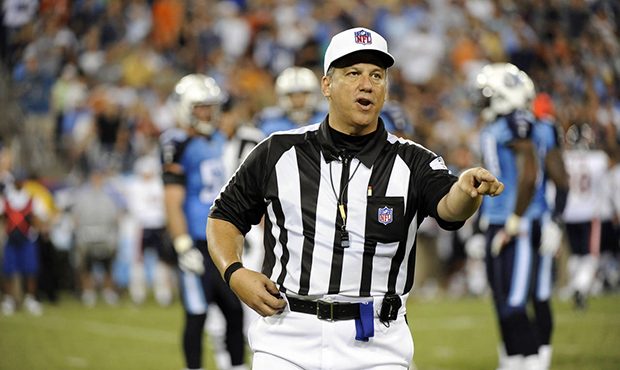 FILE - In this Aug. 27, 2011, file photo, referee Alberto Riveron makes a call in the second quarte...