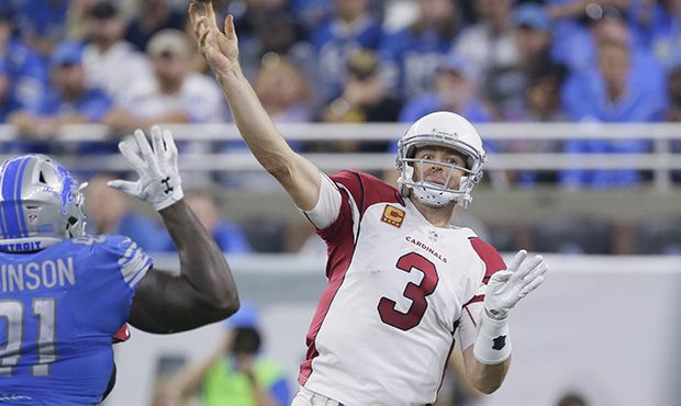 Arizona Cardinals quarterback Carson Palmer (3) passes against the Detroit Lions during an NFL foot...