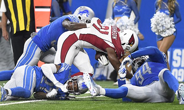 Arizona Cardinals running back David Johnson (31) is brought down against the Detroit Lions during ...