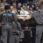 Arizona Diamondbacks' A.J. Pollock is congratulated at the dugout by Paul Goldschmidt after hitting a home run during the first inning of a baseball game against the San Diego Padres Tuesday, Sept. 19, 2017, in San Diego. (AP Photo/Orlando Ramirez)