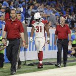 Arizona Cardinals running back David Johnson (31) walks off the field with medical staff for X-rays during an NFL football game against the Detroit Lions in Detroit, Sunday, Sept. 10, 2017. (AP Photo/Jose Juarez)