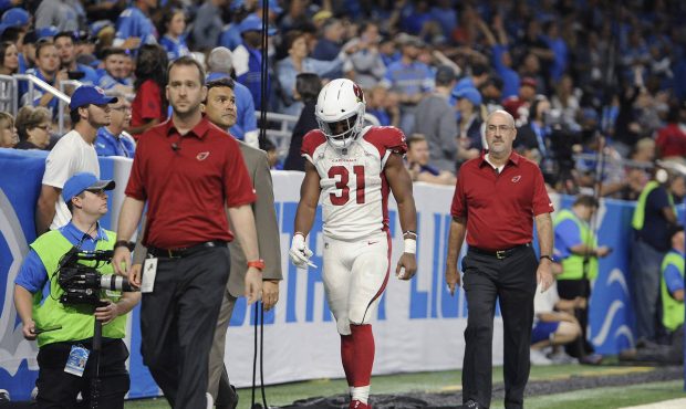 Arizona Cardinals running back David Johnson (31) walks off the field with medical staff for X-rays...