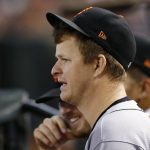 San Francisco Giants pitcher Matt Cain watches the baseball game against the Arizona Diamondbacks from the dugout during the third inning Wednesday, Sept. 27, 2017, in Phoenix.  Cain Cain says he'll retire after his start at home on Saturday against San Diego. (AP Photo/Ross D. Franklin)