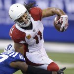 Arizona Cardinals' Larry Fitzgerald (11) is tackled by Indianapolis Colts' Nate Hairston (27) during the first half of an NFL football game Sunday, Sept. 17, 2017, in Indianapolis. (AP Photo/Michael Conroy)