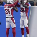 Arizona Cardinals cornerback Justin Bethel (28) celebrates his 82-yard interception for a touchdown with Patrick Peterson (21) during the first half of an NFL football game against the Detroit Lions in Detroit, Sunday, Sept. 10, 2017. (AP Photo/Jose Juarez)