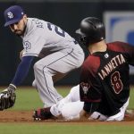 Arizona Diamondbacks' Chris Iannetta (8) is tagged out by San Diego Padres' Carlos Asuaje trying to stretch a single into a double during the first inning of a baseball game, Saturday, Sept. 9, 2017, in Phoenix. (AP Photo/Matt York)