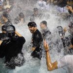Arizona Diamondbacks' Adam Rosales, center, celebrates with teammates in the Chase Field pool after clinching a National League Wild Card playoff spot after a baseball game against the Miami Marlins, Sunday, Sept. 24, 2017, in Phoenix. (AP Photo/Ross D. Franklin)