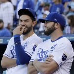 Kansas City Royals' Mike Moustakas, right, and Eric Hosmer watch a video on highlights showing Moustakas' home runs during the season before a baseball game against the Arizona Diamondbacks, Saturday, Sept. 30, 2017, in Kansas City, Mo. Moustakas set a new Royals season home run record with 38 home runs. (AP Photo/Charlie Riedel)