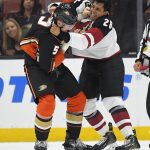 Anaheim Ducks defenseman Korbinian Holzer, left, of Germany, and Arizona Coyotes right wing Emerson Etem fight during the second period of a preseason NHL hockey game, Wednesday, Sept. 20, 2017, in Anaheim, Calif. (AP Photo/Mark J. Terrill)
