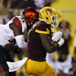 Arizona State's Kalen Ballage, right, scores a touchdown as he beats San Diego State's Chibu Onyeukwu (55) during the first half of an NCAA college football game Saturday, Sept. 9, 2017, in Tempe, Ariz. (AP Photo/Ross D. Franklin)