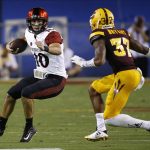 San Diego State quarterback Christian Chapman (10) runs with the ball as Arizona State's Joey Bryant (37) cuts off the running lane during the first half of an NCAA college football game Saturday, Sept. 9, 2017, in Tempe, Ariz. (AP Photo/Ross D. Franklin)