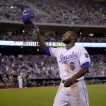 Kansas City Royals' Lorenzo Cain acknowledges the crowd as he comes out of a baseball game during the sixth inning against the Arizona Diamondbacks, Saturday, Sept. 30, 2017, in Kansas City, Mo. (AP Photo/Charlie Riedel)