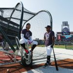 Colorado Rockies right fielder Carlos Gonzalez, left, jokes with shortstop Alexi Amarista as they wait for their time in the cage during batting practice before hosting the Arizona Diamondbacks in a baseball game Saturday, Sept. 2, 2017, in Denver. (AP Photo/David Zalubowski)