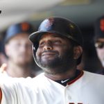 San Francisco Giants' Pablo Sandoval is greeted in the dugout after hitting a sacrifice fly to score Austin Slater during the fourth inning of a baseball game against the Arizona Diamondbacks, Sunday, Sept. 17, 2017, in San Francisco. (AP Photo/George Nikitin)