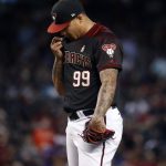 Arizona Diamondbacks starting pitcher Taijuan Walker looks down after giving up a home run to the Miami Marlins during the fourth inning of a baseball game, Saturday, Sept. 23, 2017, in Phoenix. (AP Photo/Matt York)