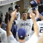 San Diego Padres' Hunter Renfroe is congratulated in the dugout after hitting a home run during the fifth inning of a baseball game against the Arizona Diamondbacks Wednesday, Sept. 20, 2017, in San Diego. (AP Photo/Orlando Ramirez)