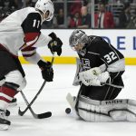Arizona Coyotes left wing Brendan Perlini, left, of England, tries to get a shot in on Los Angeles Kings goalie Jonathan Quick during the first period of a preseason NHL hockey game, Thursday, Sept. 28, 2017, in Los Angeles. (AP Photo/Mark J. Terrill)