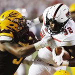 Texas Tech's Desmond Nisby carries the ball during the first half while defended by Arizona State's Joseph Bryant during the fort half of an NCAA college football game Saturday, Sept. 16, 2017, in Lubbock, Texas. (Mark Rogers/Lubbock Avalanche-Journal via AP)
