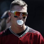 Arizona Diamondbacks' Jake Lamb blows a bubble with his gum before batting against Colorado Rockies starting pitcher German Marquez in the first inning of a baseball game Sunday, Sept. 3, 2017, in Denver. (AP Photo/David Zalubowski)