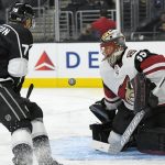 Los Angeles Kings left wing Tanner Pearson, left, tries to get a shot in on Arizona Coyotes goalie Louis Domingue during the second period of a preseason NHL hockey game, Thursday, Sept. 28, 2017, in Los Angeles. (AP Photo/Mark J. Terrill)