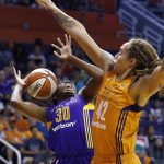 Phoenix Mercury's Brittney Griner (42) fouls Los Angeles Sparks' Nneka Ogwumike (30) on a shot during the first half of Game 3 of a WNBA basketball playoff semifinal Sunday, Sept. 17, 2017, in Phoenix. (AP Photo/Ross D. Franklin)