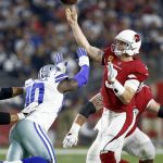 Arizona Cardinals quarterback Carson Palmer (3) throws under pressure from Dallas Cowboys defensive end Demarcus Lawrence (90) during the first half of an NFL football game, Monday, Sept. 25, 2017, in Glendale, Ariz. (AP Photo/Ross D. Franklin)