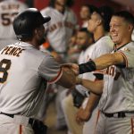 San Francisco Giants' Hunter Pence and Nick Hundley have a little fun with each other after the pair hit home runs against the Arizona Diamondbacks in the fourth inning inning of a baseball game, Monday, Sept. 25, 2017 in Phoenix. Hundley had a three run home run while Pence had a solo shot. (AP Photo/Darryl Webb)