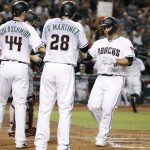 Arizona Diamondbacks' Chris Iannetta, right, is congratulated by teammates Paul Goldschmidt (44) and J.D. Martinez (28) after his three-run home run against the Miami Marlins during the first inning of a baseball game, Friday, Sept. 22, 2017, in Phoenix. (AP Photo/Ralph Freso)