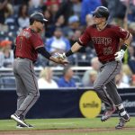 Arizona Diamondbacks' Jake Lamb is congratulated by Tony Perezchica as he rounds third base after hitting a home run during the second inning of a baseball game against the San Diego Padres Wednesday, Sept. 20, 2017, in San Diego. (AP Photo/Orlando Ramirez)