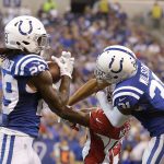 Indianapolis Colts' Malik Hooker (29) makes an interception on a pass intended for Arizona Cardinals' J.J. Nelson, center, during the first half of an NFL football game Sunday, Sept. 17, 2017, in Indianapolis. (AP Photo/Michael Conroy)