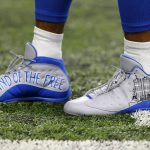Detroit Lions wide receiver Golden Tate wears cleats adorned with a remembrance of the 9/11 terrorist attacks on the World Trade Center in New York during an NFL football game against the Arizona Cardinals in Detroit, Sunday, Sept. 10, 2017. (AP Photo/Paul Sancya)