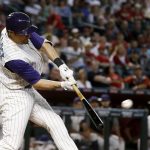 Arizona Diamondbacks' A.J. Pollock connects for a three-run double against the Colorado Rockies during the first inning of a baseball game Thursday, Sept. 14, 2017, in Phoenix. (AP Photo/Ross D. Franklin)