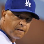 Los Angeles Dodgers manager Dave Roberts watches from the dugout during the first inning of a baseball game against the Arizona Diamondbacks, Tuesday, Sept. 5, 2017, in Los Angeles. (AP Photo/Mark J. Terrill)