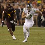 Oregon tight end Jacob Breeland (27) runs after making a reception, as Arizona State linebacker DJ Calhoun gives chase during the second half of an NCAA college football game, Saturday, Sept. 23, 2017, in Tempe, Ariz. Arizona State defeated Oregon 37-35. (AP Photo/Rick Scuteri)