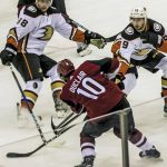 Arizona Coyotes left wing Anthony Duclair (10) passes the puck against Anaheim Ducks defenders during the first period of an NHL preseason hockey game Monday, Sept. 25, 2017, in Tucson, Ariz. (Ron MedvescekArizona Daily Star via AP)
