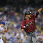 Arizona Diamondbacks' Ketel Marte, right, gestures toward second after scoring on a double by Adam Rosales as Los Angeles Dodgers relief pitcher Luis Avilan walks back to the mound during the seventh inning of a baseball game, Wednesday, Sept. 6, 2017, in Los Angeles. (AP Photo/Mark J. Terrill)