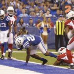 Indianapolis Colts' Frank Gore (23) goes in for a five-yard touchdown run while being tackled by Arizona Cardinals' Antoine Bethea during the first half of an NFL football game Sunday, Sept. 17, 2017, in Indianapolis. (AP Photo/Michael Conroy)