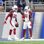 Arizona Cardinals cornerback Justin Bethel (28) celebrates with strong safety Antoine Bethea (41) after intercepting a Detroit Lions quarterback Matthew Stafford pass for an 82-yard touchdown during the first quarter of an NFL football game in Detroit, Sunday, Sept. 10, 2017. (AP Photo/Jose Juarez)