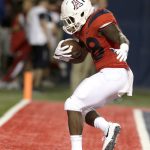 Arizona running back Nick Wilson celebrates after scoring a touchdown against Northern Arizona during the first half of an NCAA college football game, Saturday, Sept. 2, 2017, in Tucson, Ariz. (AP Photo/Rick Scuteri)
