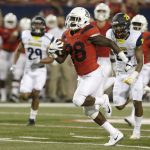 Arizona running back Nick Wilson (28) carries for a touchdown against Northern Arizona during the first half of an NCAA college football game, Saturday, Sept. 2, 2017, in Tucson, Ariz. (AP Photo/Rick Scuteri)