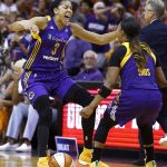 Los Angeles Sparks' Candace Parker (3) celebrates with Odyssey Sims, right, at the end of Game 3 of a WNBA basketball playoff semifinal against the Phoenix Mercury, Sunday, Sept. 17, 2017, in Phoenix. (AP Photo/Ross D. Franklin)