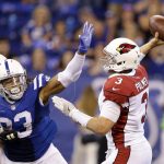 Arizona Cardinals quarterback Carson Palmer (3) throws while being pressured by Indianapolis Colts' Jabaal Sheard (93) during the second half of an NFL football game Sunday, Sept. 17, 2017, in Indianapolis. Sheard was called for roughing the passer on the play. (AP Photo/Michael Conroy)
