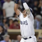 San Diego Padres' Christian Villanueva points to the sky as he reaches home plate after hitting a home run during the fifth inning of a baseball game against the Arizona Diamondbacks Wednesday, Sept. 20, 2017, in San Diego. (AP Photo/Orlando Ramirez)