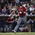 Arizona Diamondbacks' Chris Herrmann looks back as he heads home on a double by David Peralta during the seventh inning of a baseball game against the San Diego Padres on Wednesday, Sept. 20, 2017, in San Diego. (AP Photo/Orlando Ramirez)